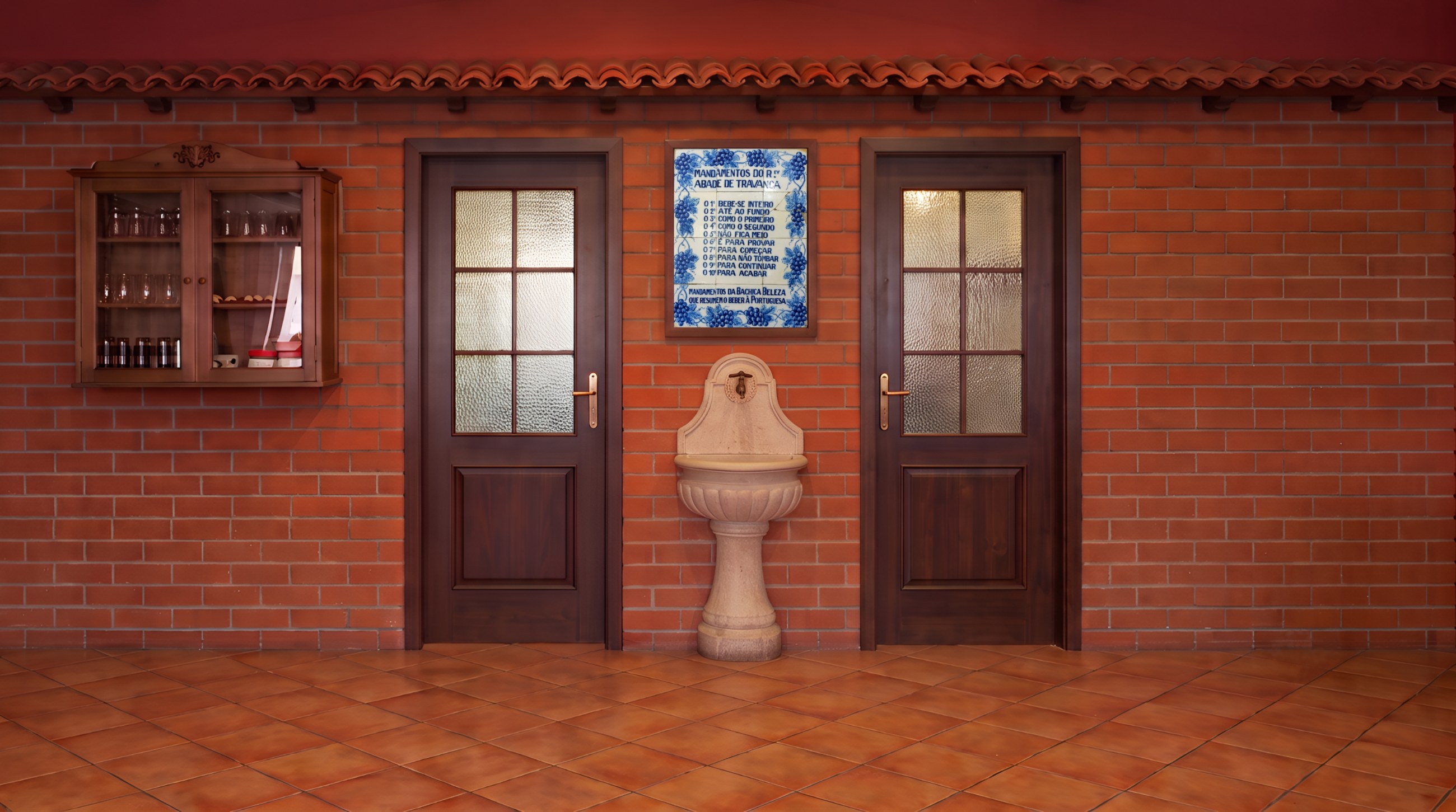 Fachada e entrada do Restaurante Zona Verde, com a placa dos Mandamentos do Abade de Travança entre as duas portas
